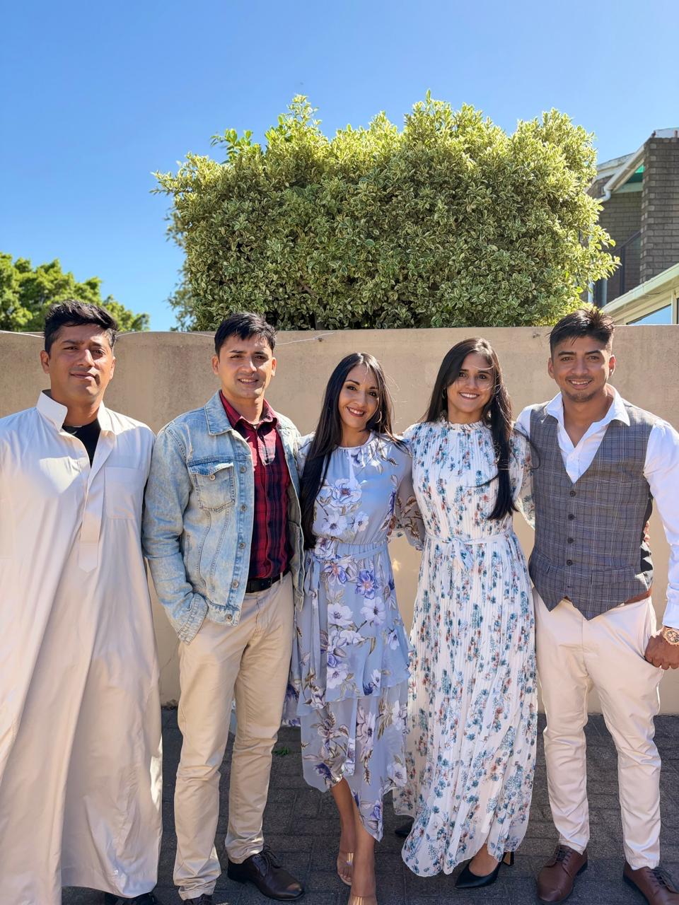 Teacher Najwa with family at a celebration
