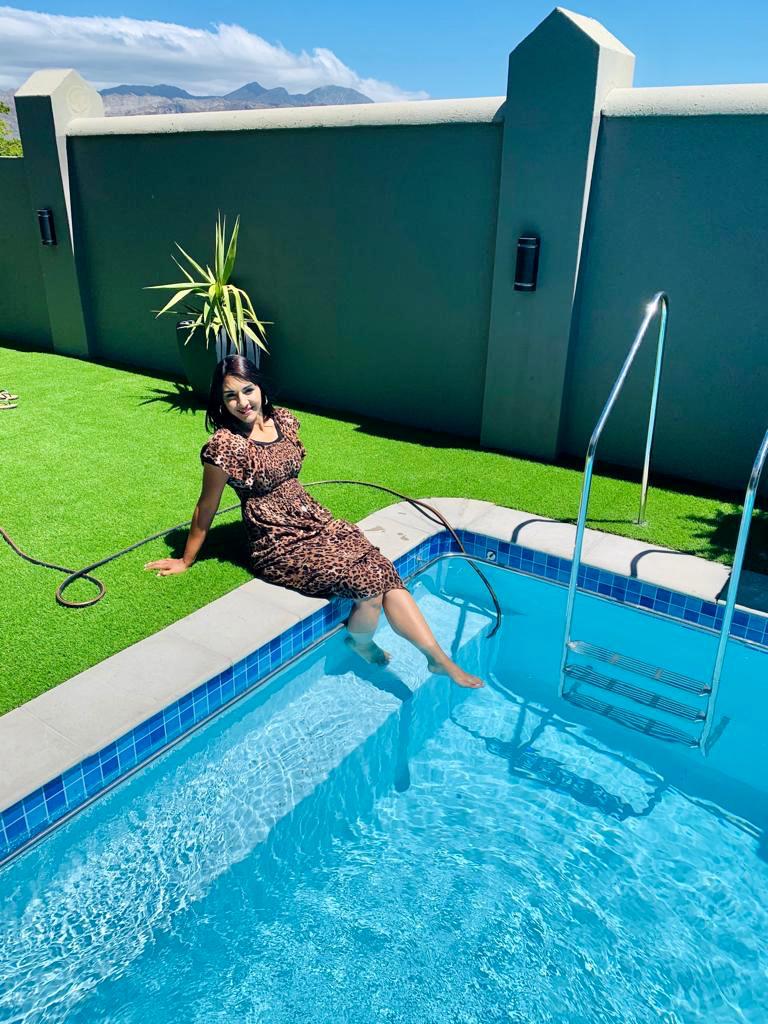 Teacher Najwa relaxing by a pool